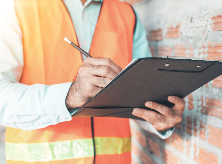 an inspector holding a checklist 1